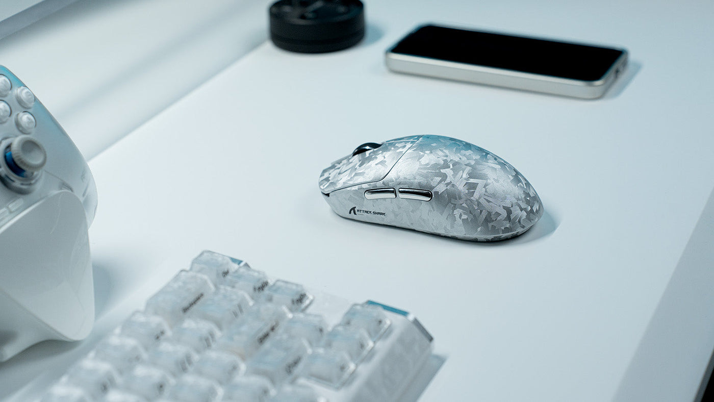 ATTACK SHARK wireless gaming mouse with icy patterned shell on a white desk setup